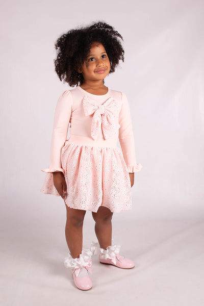 This adorable girls pink top & skirt Set by Beau KiD is perfect for spring and summer seasons. Made for girls in sizes 2/3 year up to 6/7 year old, this two-piece outfit features a large bow on the top for added style. Elevate your little one's wardrobe with this stylish and comfortable ensemble.