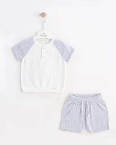 <p>Introducing our Leo King branded boys short set for spring and summer season. This two piece knitted set includes grey and white top, grey shorts with an elasticated waistband. The top is matching with a round neck collar and short sleeves. Made from 100% cotton, available in sizes from 6-9 months up to 18-24 months. Get your little one ready for the warmer months in style and comfort.</p>