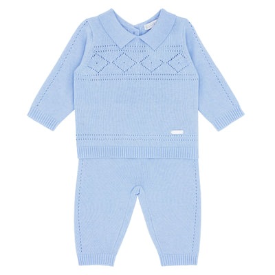 Blues Baby branded boys two piece knitted pointelle set finished in a soft blue colour. This top has a collar detail and button fastening on the reverse, and the trousers have a elasticated waistband. Available in sizes 3 month up to 24 month size.