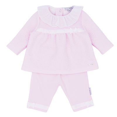Blues Baby branded girls jacquard top and interlock trouser set. The top has a bow on the front and a pointelle collar. The trouser has small bow detail to the ankle. Available in sizes 3 month up to 12 month.