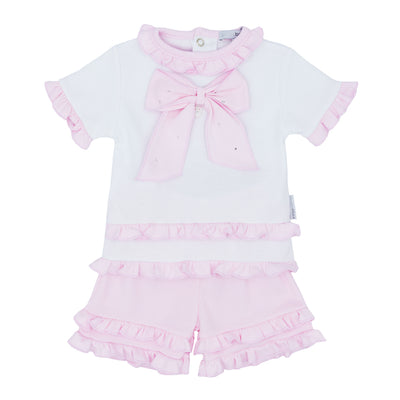 Introduce your little one to style with this adorable two piece set from kids boutique brand Blues Baby. The white t-shirt features a sparkling pink diamanté bow, while the pink frilly shorts add a touch of girly charm. Available in sizes 3 months to 24 months. Perfect for any occasion!