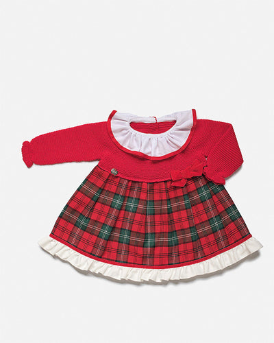 This girls red checked long sleeve dress is crafted by Spanish childrenswear brand Juliana for winter days. The dress features a classic checked print on red fabric, with a button fastening on the reverse for a snug fit. Perfect for a festive Christmas day outfit, it is available in sizes 3 months up to 4 years old.