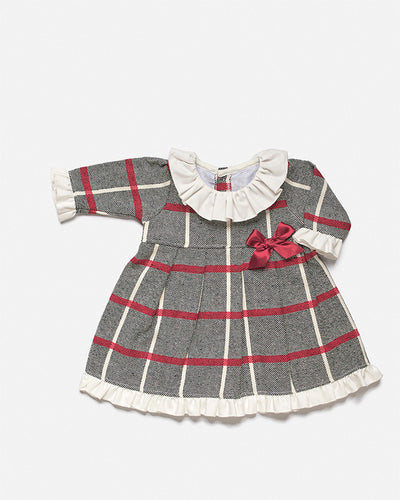 This Juliana branded dress is perfect for keeping your little one warm in the winter. It is finished in a red and black checked design, with a white frill collar and a small red bow to the side. It features a button fastening on the reverse, available in sizes 3 months up to 4 years old.