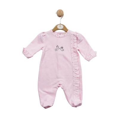 This beautiful baby girls' sleepsuit from Mintini Baby is perfect for everyday wear. Crafted from soft and lightweight fabric, this pink all-in-one features a round neck collar, push button fastening on the reverse, and a sparkly diamanté bow and frill detail down the front. Ideal for comfort and style. Available in sizes 1 month, 3 month & 6 month.