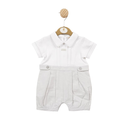 This Mintini Baby branded romper is perfect for keeping your baby boy cool and stylish this summer. Featuring a white and grey gingham print and a collar detail, this short sleeve romper is ideal for sizes 3 months up to 12 months. With a button fastening on the reverse, it's both functional and fashionable.