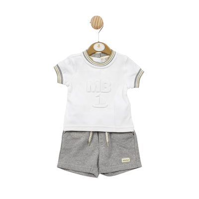 Enhance your little boy's style with our Mintini Baby branded, two piece set. The white round neck t-shirt features grey, white, and yellow piping around the neck and arms for a sporty look, completed with the MB logo in the middle of the top. The grey shorts with side pockets and drawstring fastening offer comfort and convenience. Available in sizes 3 months to 24 months.