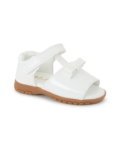 Introduce your little girl to summertime fashion with our Sevva branded white patent sandals. These adorable shoes feature a stylish bow detail and convenient velcro strap fastening. Perfect for any occasion, these sandals will keep her comfortable and stylish all day long.