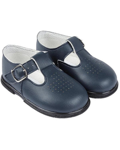 Navy faux leather 'Baypods' first walker shoes. Made in England, these smart, traditionally styled shoes are the perfect choice for babies and toddlers. They have buckle fastening straps to keep securely on little feet and rounded shaped toes for correct foot development. . Faux leather uppers Textile lining Wipe clean Buckle strap Shoes suitable for girls and boys