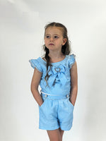 This new arrival from Beau Kid is perfect for your young fashionista. This two piece set features a vibrant blue top with a large bow and matching shorts. From the stylish spring/summer collection, it comes in sizes 2-3 year old up to 9-10 year old.