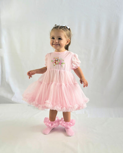 Introducing our new arrival for the spring summer season - the girls pink tutu teddy bear dress! This adorable short sleeve dress features a cute teddy bear motif and a playful tutu skirt. Available in sizes 1-2 years old up to a to 5-6 years old, this Beau Kid branded dress is perfect for any little girl's wardrobe.