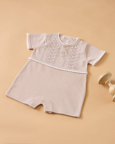<p>This adorable short sleeve romper from Leo King is perfect for your baby boy this spring and summer! Made from a soft beige fabric, it is comfortable for your little one to wear and comes in sizes ranging from 1-3 months up to 9-12 months. Dress your baby in style with this must-have piece from our Leo King spring summer collection.</p>