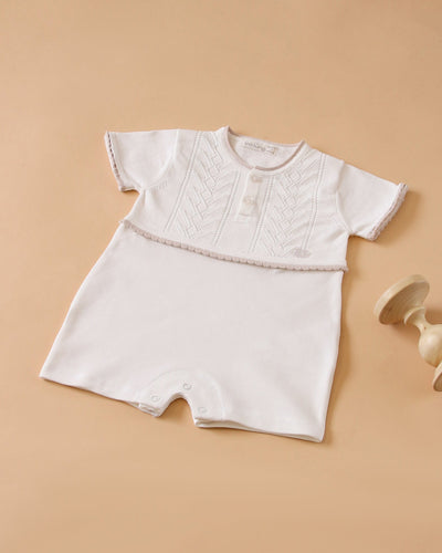 <p>Dress your baby boy in style this spring and summer with this Leo King branded short sleeve romper finished in white colour. Made from a soft, comfortable fabric, this must-have piece is available in sizes ranging from 1-3 months up to 9-12 months. Perfect for the little one in your life!</p>