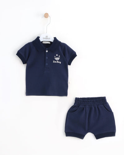 <p>Get your little one ready for the warmer months with our Leo King branded boys navy blue short set. Perfect for spring and summer season, this set includes a navy blue collared top with three button fastening and elasticated waistband shorts. Available in sizes 3-6 months up to 12-18 months.</p>
