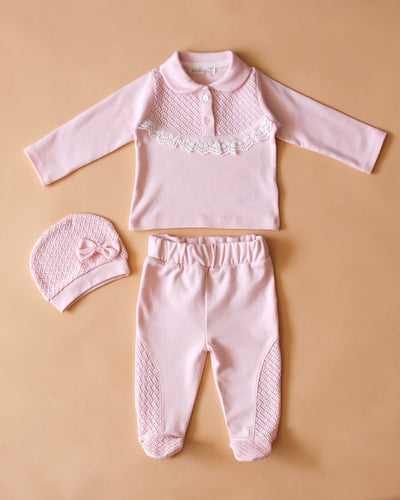 <p>Introduce your precious baby girl to the world with our Leo King three piece set, complete with a top, trousers, and hat. The delicate broderie anglaise frill on the chest adds a touch of femininity to the beautiful pink colour. Sizes range from 1-3m and 3-6m with closed feet, and 6-9m and 9-12m without closed feet.</p>
