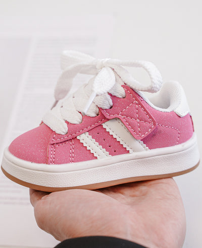 Expertly crafted for the confident young girl, these stylish pink fashion trainers are perfect for casual wear. With a low profile design, lace-up fastening, and padded tongue and cuff, these shoes offer both style and comfort. The rubber outer sole and textured grip tread provide stability, making them perfect for any adventure. Also available in black and beige colours, and come in sizes ranging from an infant size 3 up to a junior size 3.