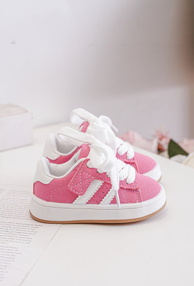 Expertly crafted for the confident young girl, these stylish pink fashion trainers are perfect for casual wear. With a low profile design, lace-up fastening, and padded tongue and cuff, these shoes offer both style and comfort. The rubber outer sole and textured grip tread provide stability, making them perfect for any adventure. Also available in black and beige colours, and come in sizes ranging from an infant size 3 up to a junior size 3.