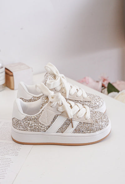 Add some sparkle to your little one's wardrobe with these beautiful girls gold glitter gum sole fashion sports trainers. Featuring a trendy sports design and lace up fastening, these trainers are perfect for any stylish young girl. Available in infant size 3 up to junior size 3. From our spring summer footwear collection.