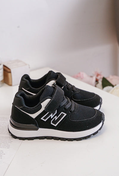 Introducing our new arrival for spring/summer, the boys black N runner trainers. Perfect for young boys, these classic runner trainers feature a sleek black colour with our signature N design. The trainers offer both lace and velcro fastening for easy wear, and are available in infant sizes 7 up to 11.