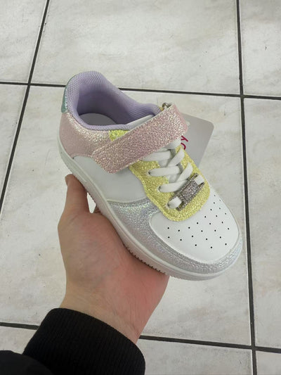 Introducing the must-have fashion trainer for girls this spring/summer season! Our white trainer comes with a vibrant rainbow multi-colour glitter finish, making it the perfect statement piece for any outfit. With lace and velcro fastening, these trainers are easy to put on and perfect for sizes infant 8 to junior 3.