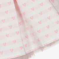 Side profile view of the Beau Kid pink set, illustrating the layered structure and flared, voluminous silhouette of the tiered tulle ruffle skirt.