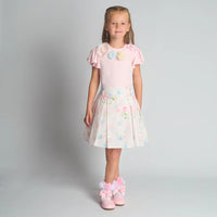 Full-length studio shot of the Beau Kid girls floral 2-piece set featuring a white t-shirt with 3D flower appliqué and a matching pleated floral skirt.