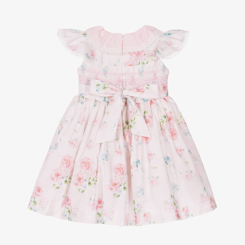 Back view of the Beau Kid pink and ivory floral dress showing the elegant sash tie and the secure concealed zip fastening.