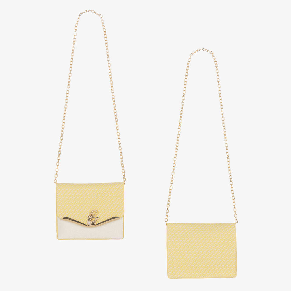 Close-up of the matching Beau Kid lemon yellow structured jacquard handbag featuring a gold-tone chain strap and a decorative yellow satin bow embellishment.