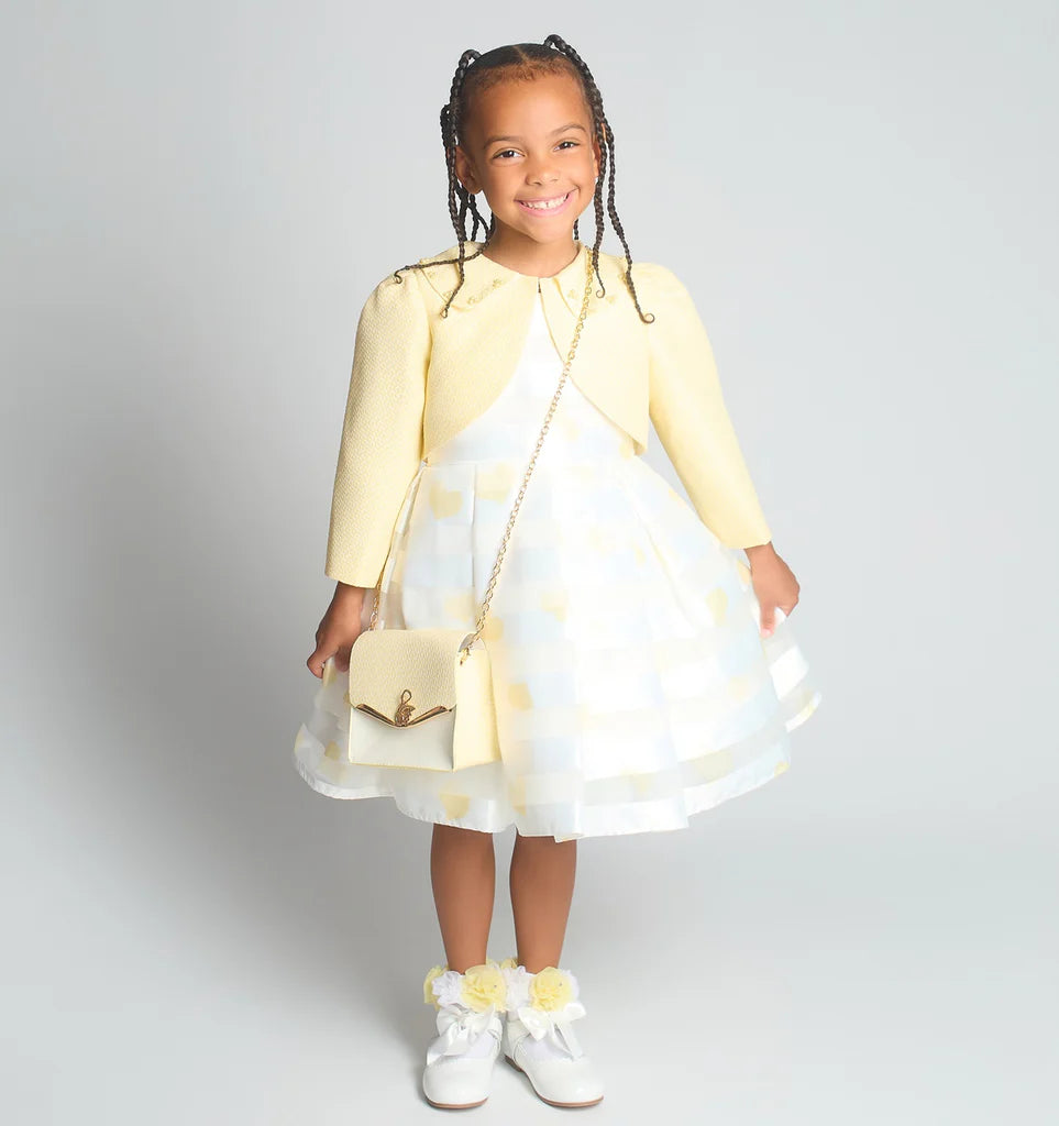 Front view of the Beau Kid girls lemon yellow 3-piece ensemble featuring a textured jacquard dress, ruffled bolero, and matching handbag.