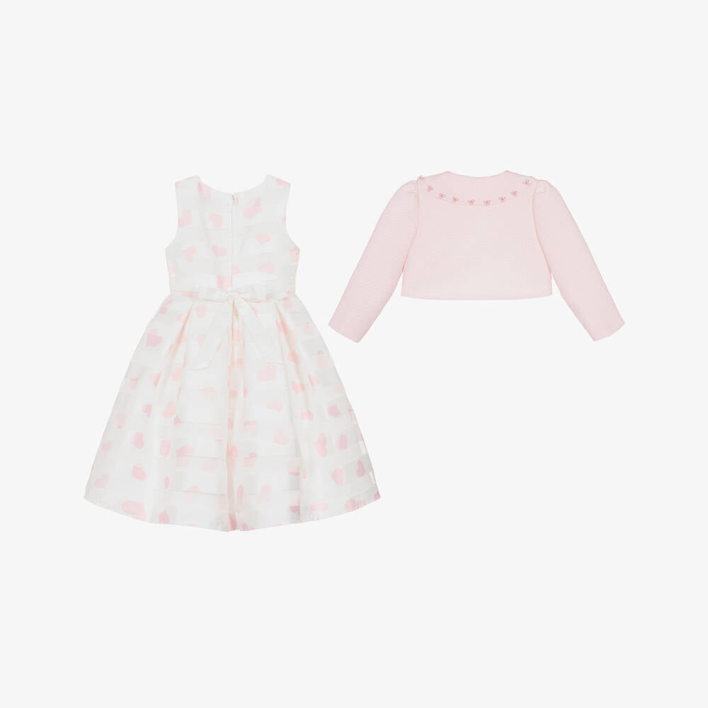 A back-view shot of the sleeveless pink jacquard dress, highlighting the deep vertical box pleats in the skirt and the concealed zip fastening running down the center of the bodice.