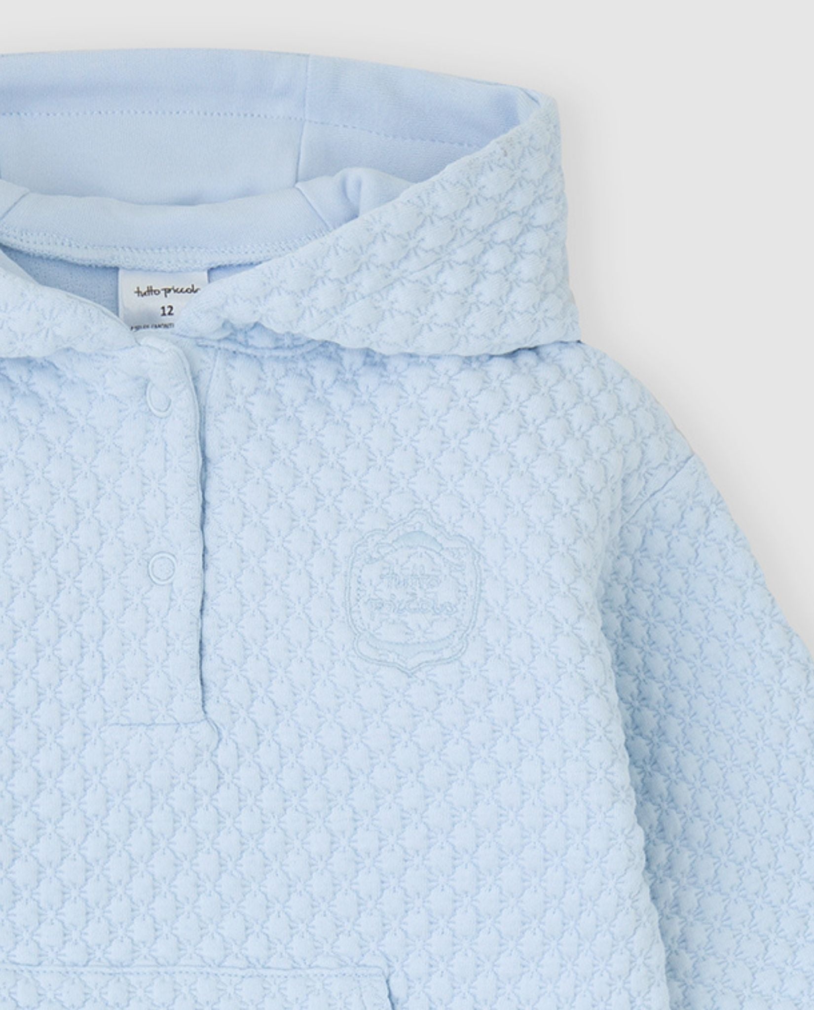 tutto piccolo boys pale blue waffle hoodie button placket and embroidered crest close up