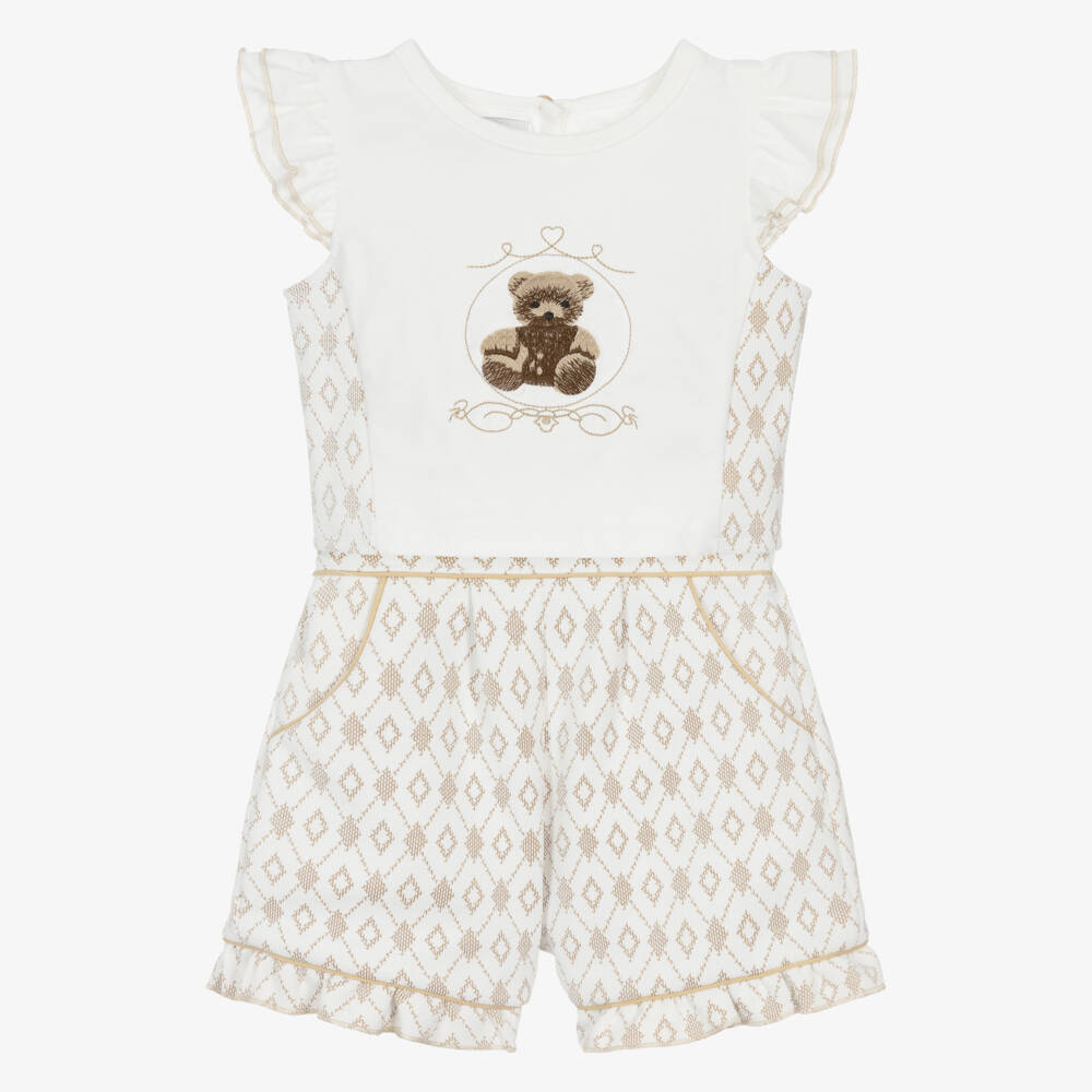 Front-facing studio shot of the Beau Kid boys 2-piece set featuring a white short-sleeved polo shirt with camel brown accents and matching tailored chino-style shorts.