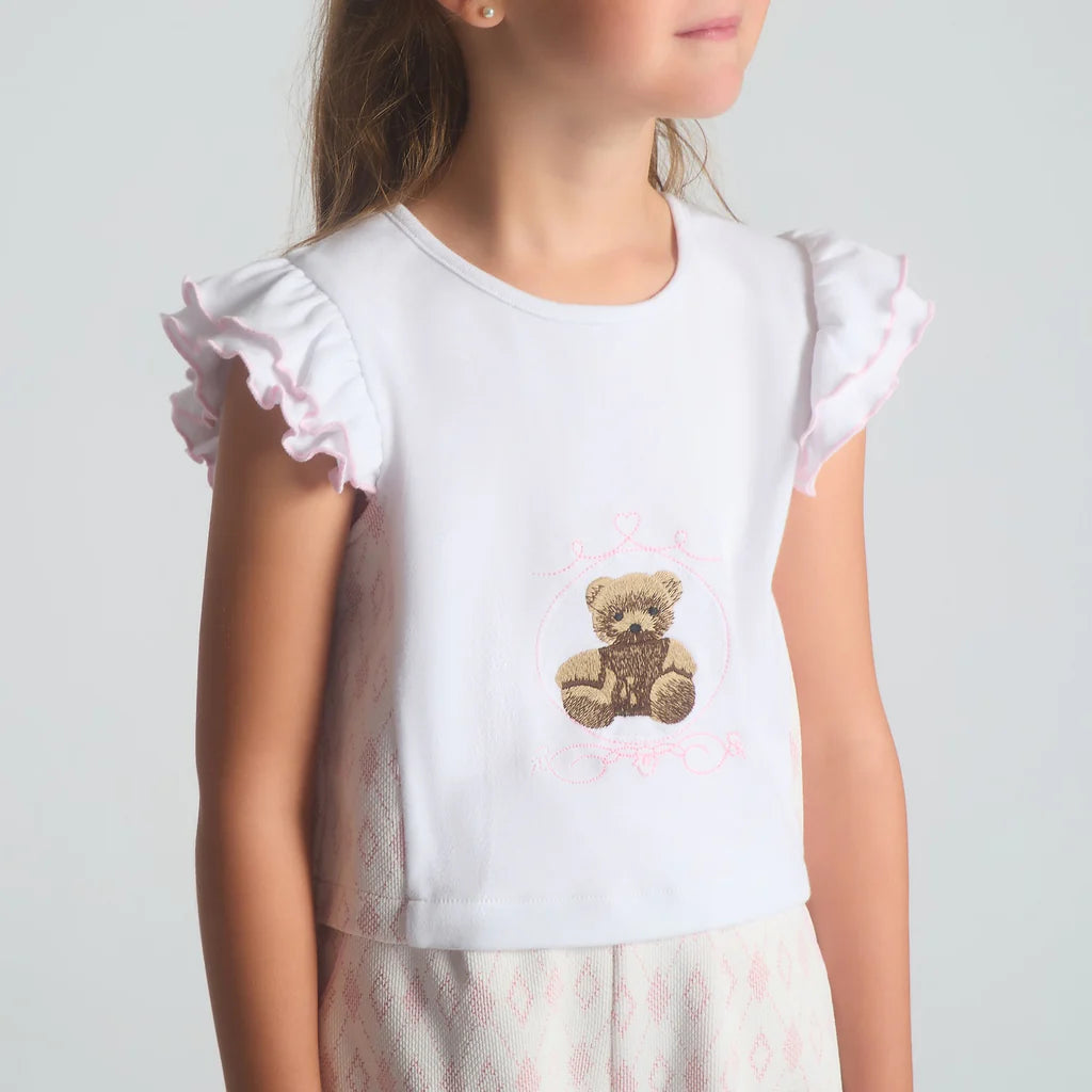 A close-up image of the Beau Kid pink jersey top highlighting the teddy bear motif and the 3D fabric bow embellishment.