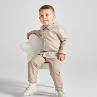 rapife boys brown check shirt beige trousers set model sitting front view