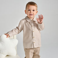 rapife boys brown check shirt beige trousers model waving close up view