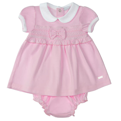 <p data-mce-fragment="1">Introducing our Amore branded girls pink classic dress with matching pants, perfect for your little ones. This dress features a classic smocked design, a beautiful bow detail in the middle, and a white collar and cuffs. It's available in sizes 0-3 months up to 18-24 months, making it a versatile option for your child's wardrobe. Complete your spring/summer collection with this stylish and comfortable dress.</p>