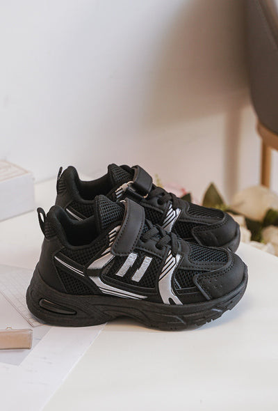 Introducing our new arrival, the unisex black chunky sole fashion trainers from our spring summer collection. These stylish trainers are perfect for both boys and girls, featuring a chunky sole and N detail on the side. With a classic black colour and equipped with shoe lace and velcro fastening, these trainers are available in toddler size 3 up to a junior size 3. Upgrade your child's wardrobe with these must-have fashion trainers.