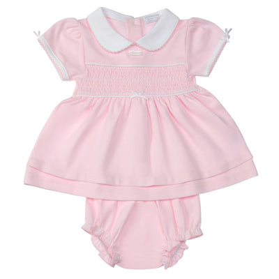 Introduce your little girl to the Amore brand with this pastel pink short sleeve smocked dress. Perfect for spring and summer season, the smocked design and small bow detail add a sweet touch. The dress comes with matching pants for a complete outfit. Available in sizes 0-3 months up to 18-24 months.