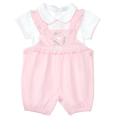 Get your little one ready for warmer weather with our Amore branded baby girls pink and white dungaree set. The set includes a white short sleeve top with collar detail and a pink dungaree with pretty heart detail. Available in sizes 0-3 month up to 6-9 months, this outfit which is part of our spring summer collection is the perfect addition to your little girl's wardrobe.