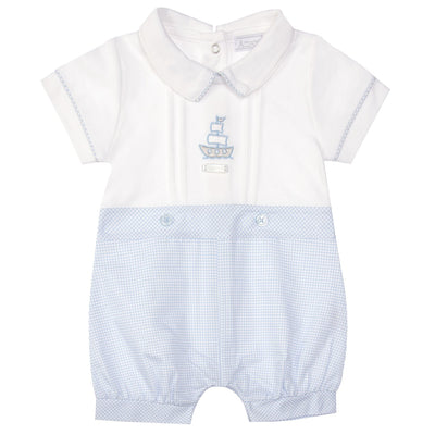 This Amore boys white and blue short sleeve romper features a classic design with a sailor ship motif on the front. The perfect summer outfit for your little sailor in sizes 0-3 months up to 18-24 months. Make a statement with this branded romper!