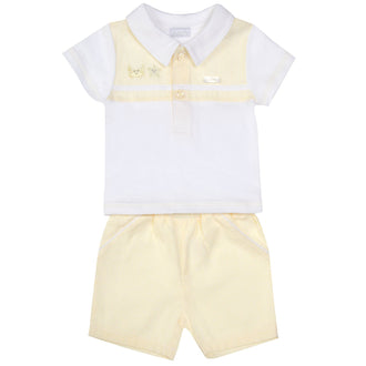 Upgrade your little one's wardrobe with the Amore boys lemon & white polo shirt and shorts set. This two-piece set features a trendy lemon box design on the polo shirt and matching lemon shorts. Perfect for the spring/summer season and Easter celebrations. Available in sizes 0-3 months up to 18-24 months.