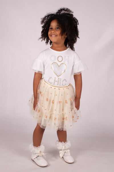 This Beau KiD branded two piece set is the perfect spring/summer outfit for girls. The white round neck top features a heart detail on the front and mesh detailing on the arms, while the cream skirt boasts a gold heart accent. Available in sizes 2/3 years up to 6/7 years, this new season set is both stylish and comfortable.