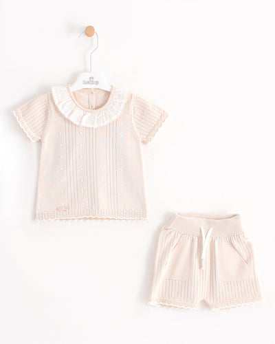 <p>The girls beige two piece top &amp; shorts set from the spring summer collection by Leo King features a frilly white collar and elasticated waistband shorts made with natural cotton. Available in sizes 6-9 month up to 18-24 month for a comfortable and stylish fit.</p>