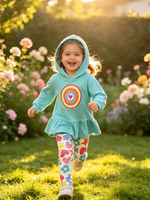 toddler running happily in a garden wearing turquoise hooded sweatshirt outfit