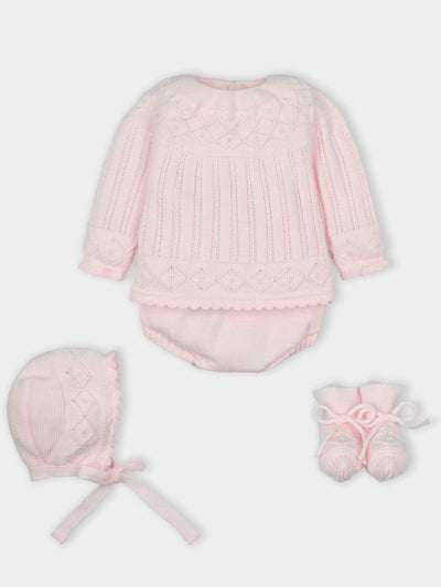 Mac Ilusion branded baby girls four piece knitted set finished in a pastel pink colour. This set consists of a long sleeve sweatshirt, bloomer shorts, a bonnet and matching booties. Comes presented in a gift box. Available in sizes 1 month, 3 month & 6 month.   Also available in White.  100% Acrylic