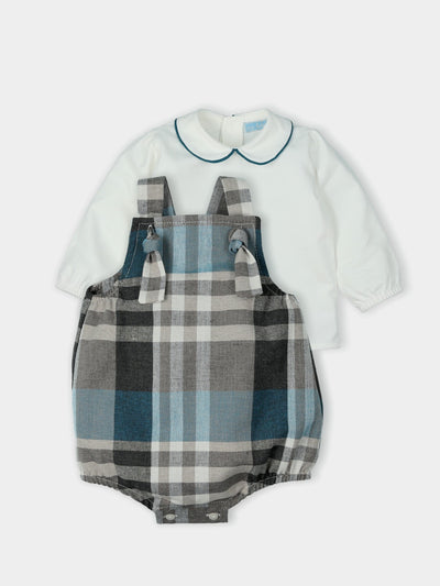 This stylish and comfortable boys blue checkered knitted dungaree set, made by Mac Ilusion, is available in sizes 3 month up to 18 month. Perfect for any season, the checkered design is sure to make your little one stand out.