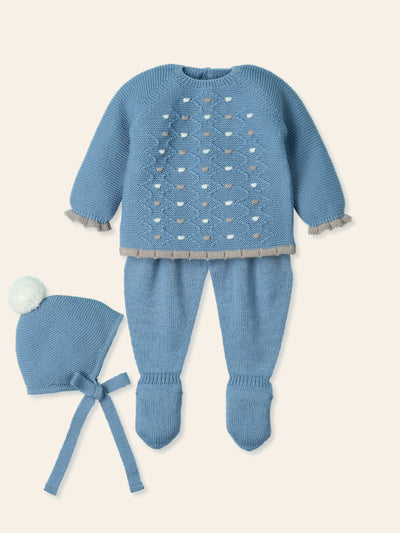 Introducing our baby boys blue spot detail three piece set by Mac Ilusion. part of our autumn / winter collection. This Spanish boutique brand offers a stunning dark blue set with grey and white spot detail on the top with grey trim around the cuffs and bottom of the top, complete with a round neck collar and long sleeves. This set includes closed feet trousers and a matching hat with a bobble. Available in sizes 1 month, 3 months, and 6 months. Comes presented in a gift box making it perfect as a baby boy 