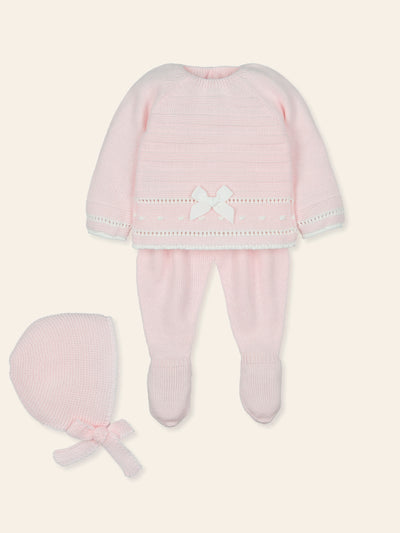 Introduce your little one to luxury with Mac Ilusion's baby girls pink knitted three piece set. The new arrival for the autumn winter collection features a delicate pastel pink design, complete with a round neck collar, long sleeve top with adorable bow detail, and the trousers have a elasticated waistband with closed feet. Add the matching bonnet for extra warmth and charm. Available in sizes 1 month, 3 months, and 6 months, this set comes beautifully packaged in a gift box.