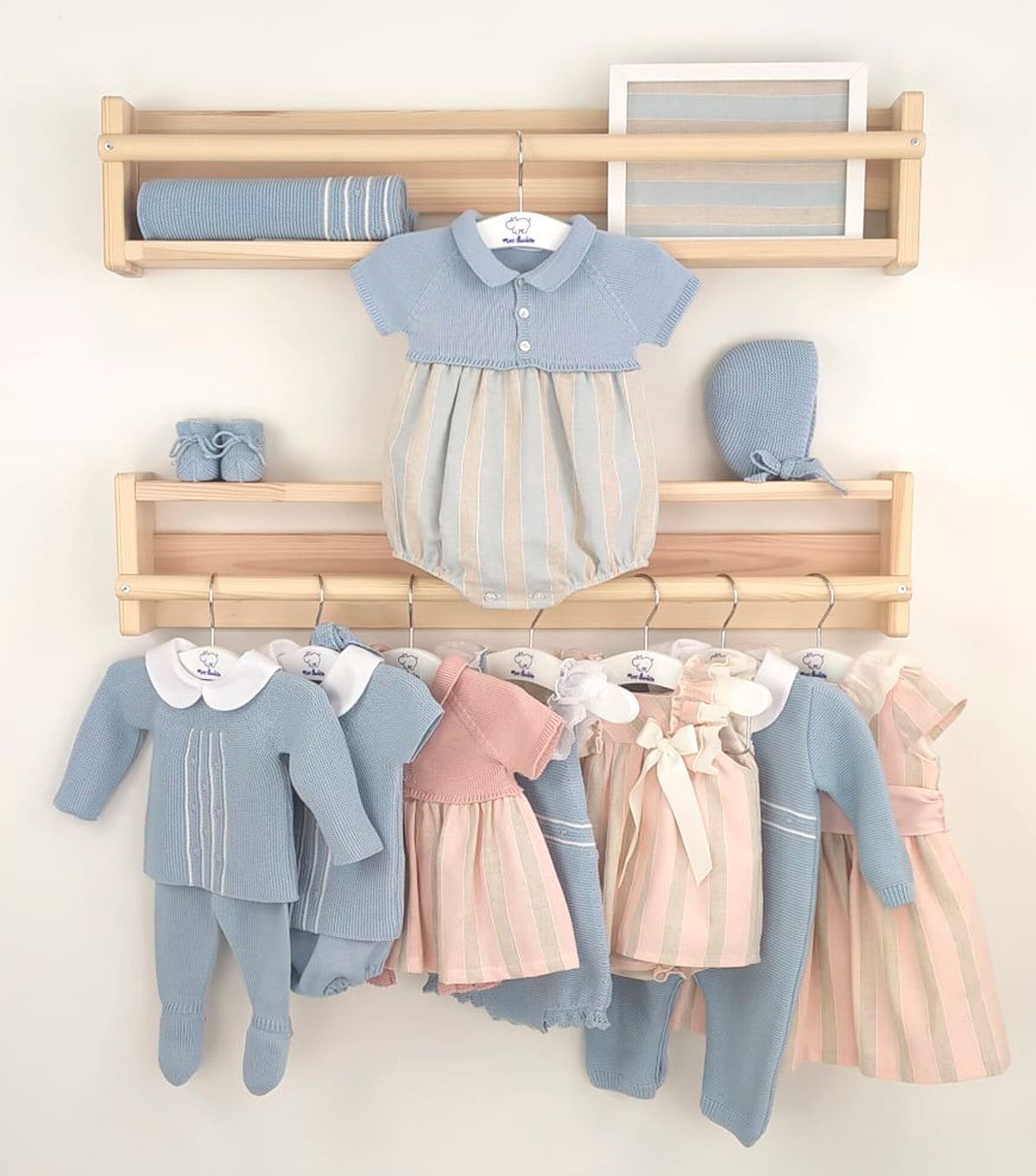Baby boy four-piece blue knitted outfit with Peter Pan collar top, matching shorts, bonnet, and booties from Mac Ilusion Spring Summer collection.