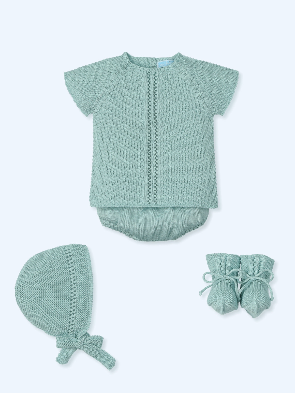 Baby boy four-piece knitted outfit in aqua with short-sleeved top, matching shorts, bonnet, and booties from Mac Ilusion Spring Summer collection.