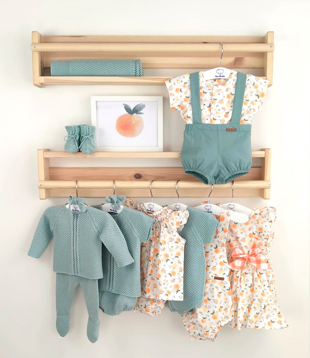 Baby boy four-piece knitted outfit in aqua with short-sleeved top, matching shorts, bonnet, and booties from Mac Ilusion Spring Summer collection.